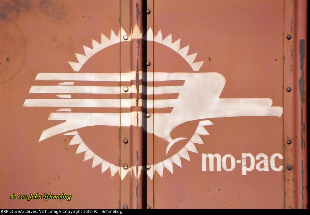 Mo-Pac's Screaming Eagle on open coal hopper MP 582759 at Mojave CA. 12/21/2011.